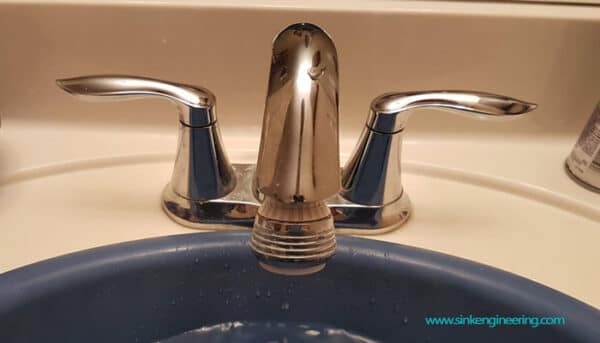 remove bathroom sink screws